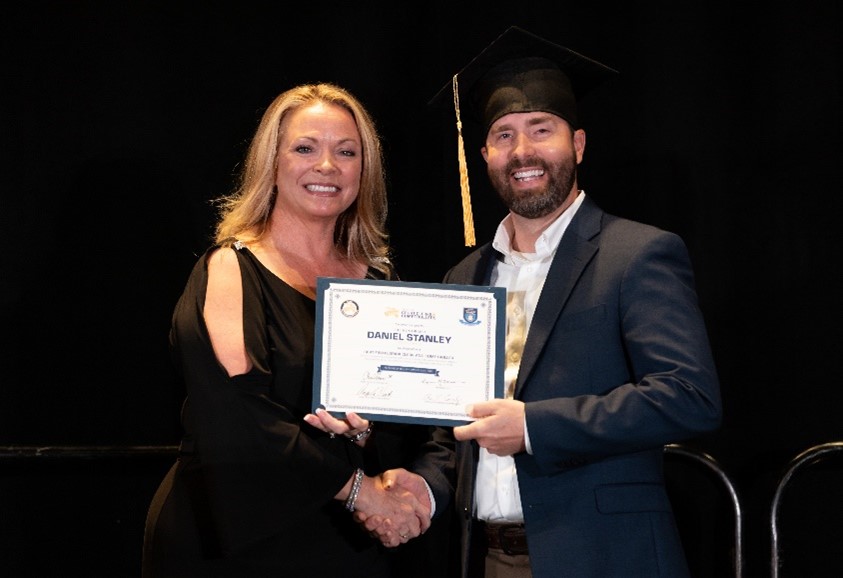 Clerk Daniel Stanley receiving his Certified Florida Clerk and Comptroller during their 2022 Summer Conference.